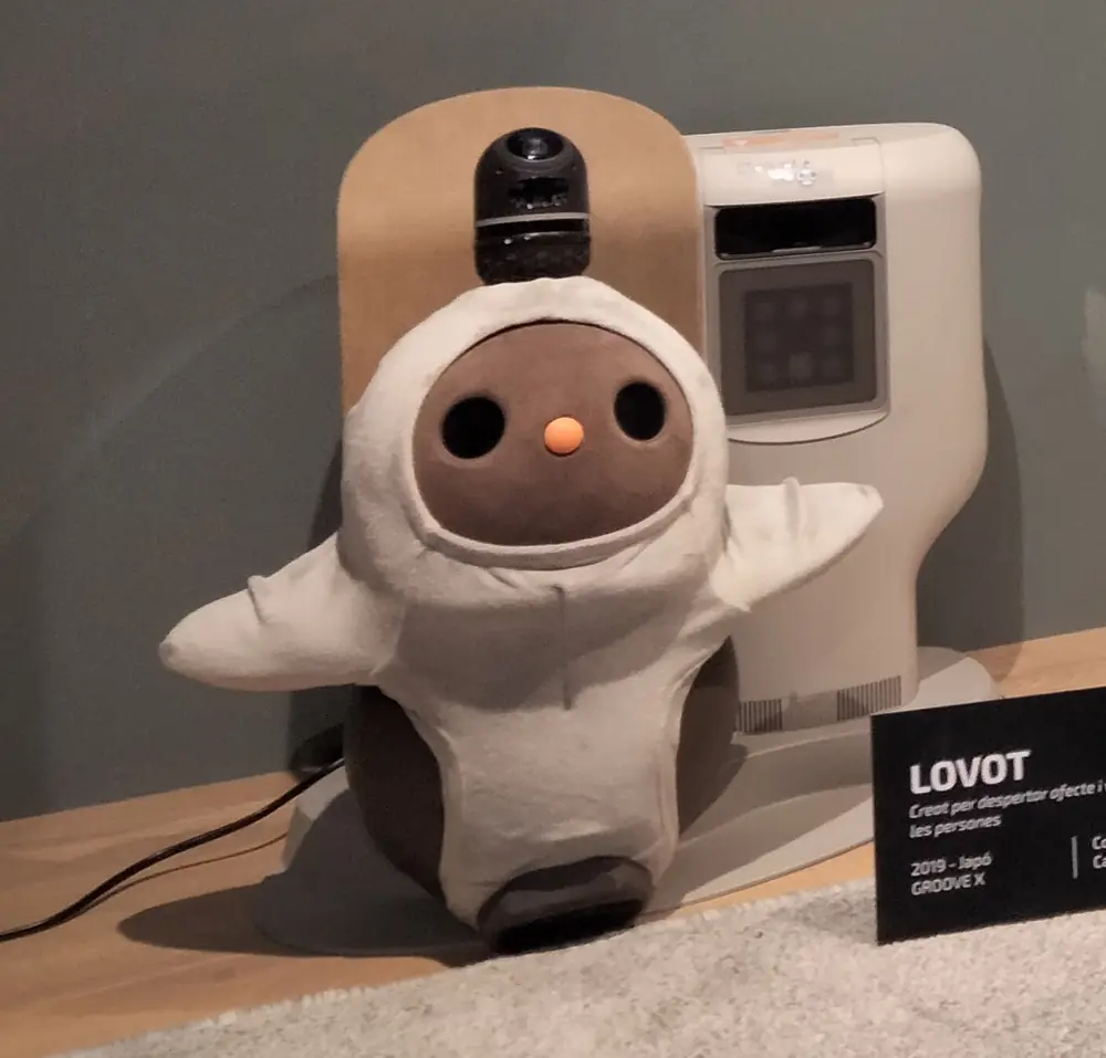 LOVOT and its charging station on display
